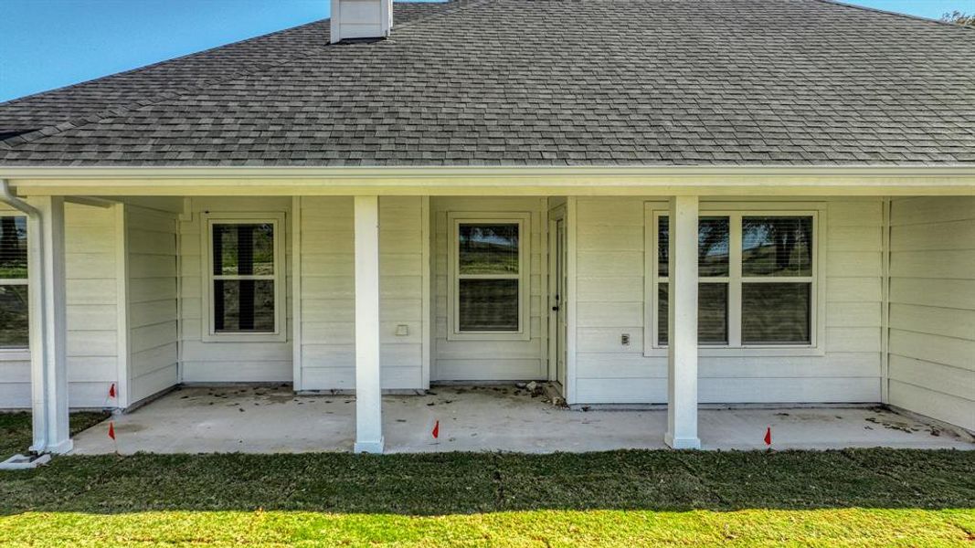 Exterior details and patio area of a home in , Poolville (Image 3).