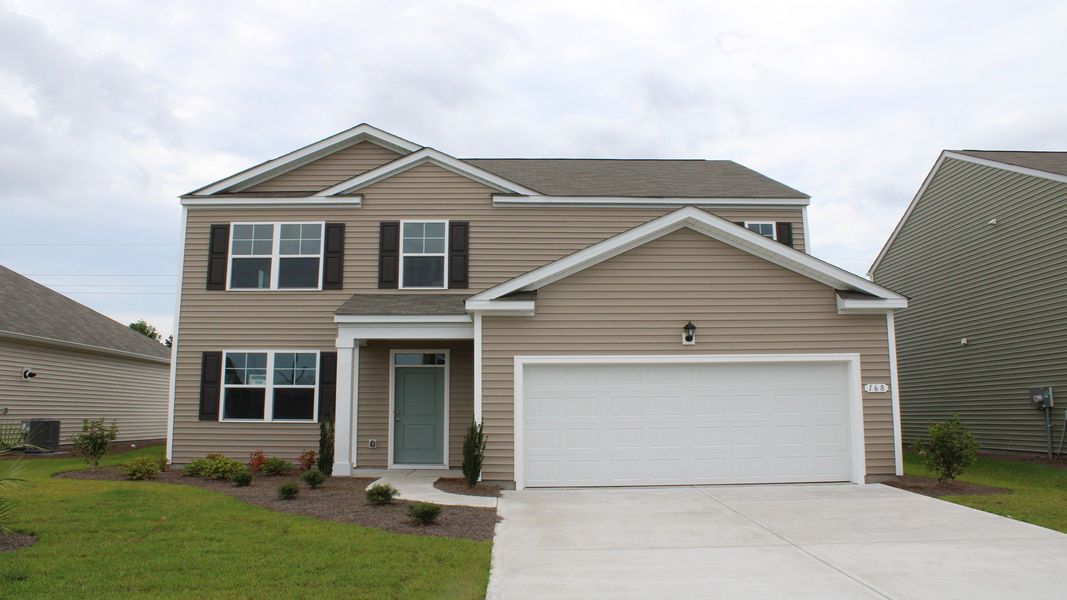 Front exterior of a new home in Jordanville Farms, Galivants Ferry, SC, highlighting curb appeal (Image 2). Front exterior of a new home in Jordanville Farms, Galivants Ferry, SC, highlighting curb appeal (Image 2).