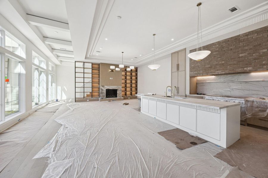 View of the island kitchen which is open to the family room.