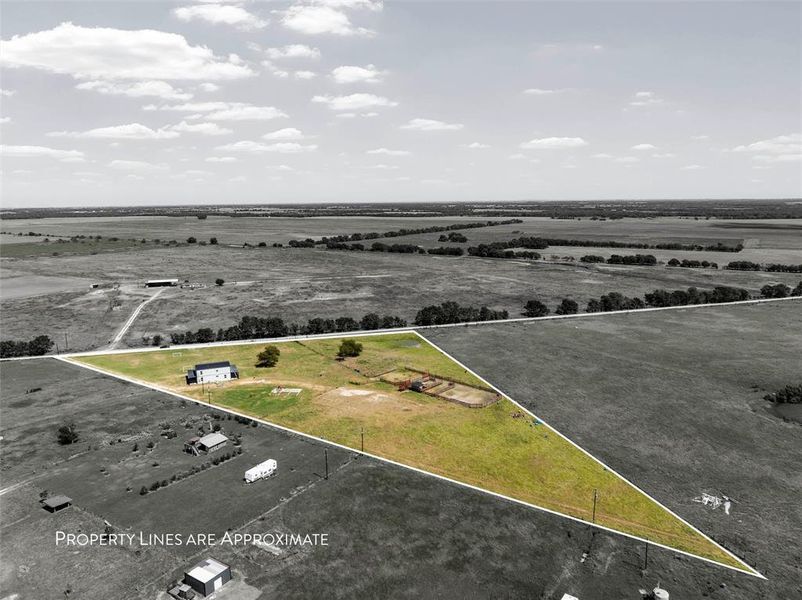 Aerial view of sparsely populated area featuring property parcel outlined Aerial view of sparsely populated area featuring property parcel outlined