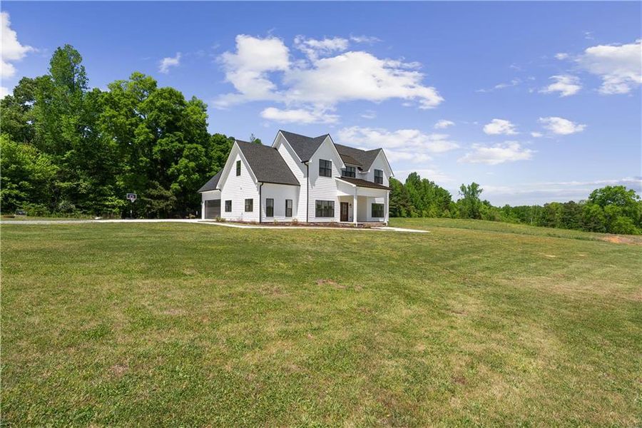 Front exterior of a new home in , Resaca, GA, highlighting curb appeal (Image 28).