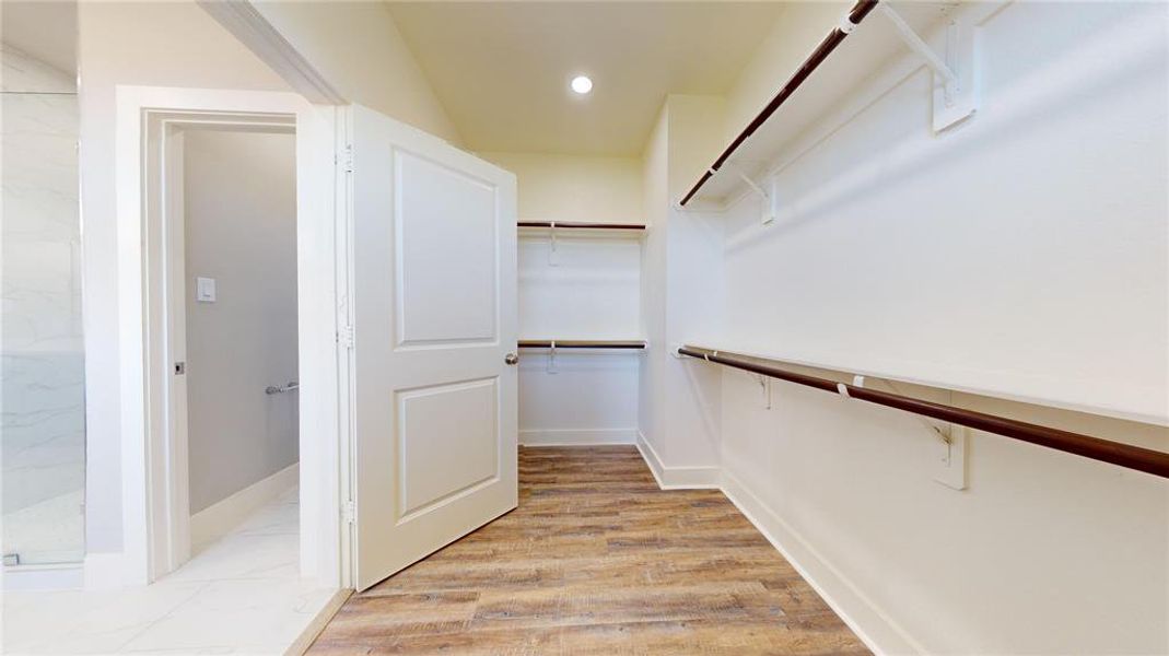 The walk-in closet in the primary bath.