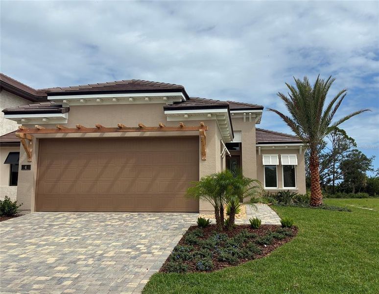 Front exterior of a new home in , Flagler Beach, FL, highlighting curb appeal (Image 11). Front exterior of a new home in , Flagler Beach, FL, highlighting curb appeal (Image 11).