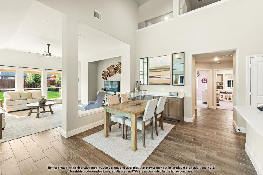 Dining area with wood table and white chairs, open to living room, high ceilings and hardwood floors Dining area with wood table and white chairs, open to living room, high ceilings and hardwood floors