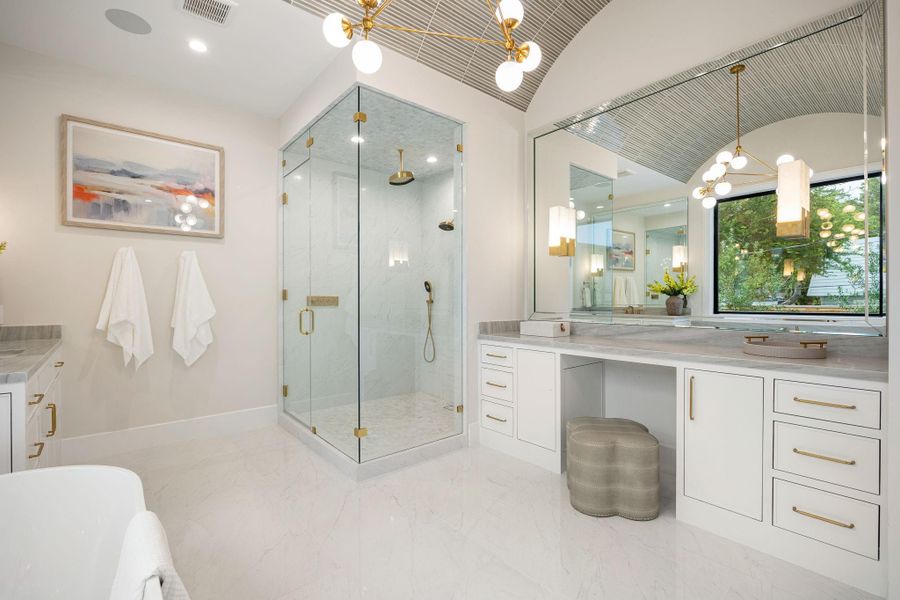 This stunning bathroom perspective highlights refined craftsmanship and thoughtful layout, with a seamless blend of materials and textures. The expansive vanity offers ample storage and preparation space. The standout feature is the oversized glass-enclosed shower, designed with clean lines and elegant finishes, creating a spa-inspired experience that enhances both functionality and style.