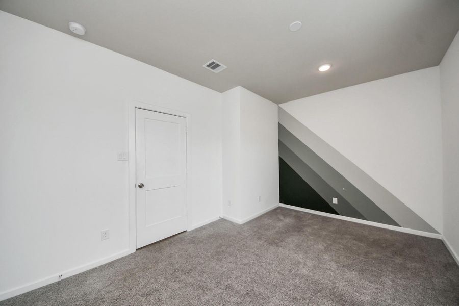 Spacious, unfurnished interior of a new home in The Groves, Humble (Image 32).
