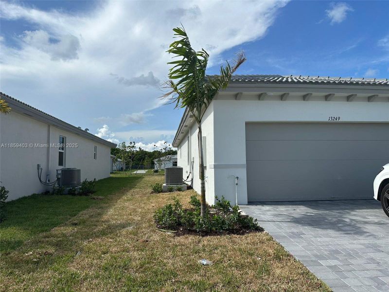 Exterior details and patio area of a home in Hawthorne at Galiano Pointe, Miami (Image 15).