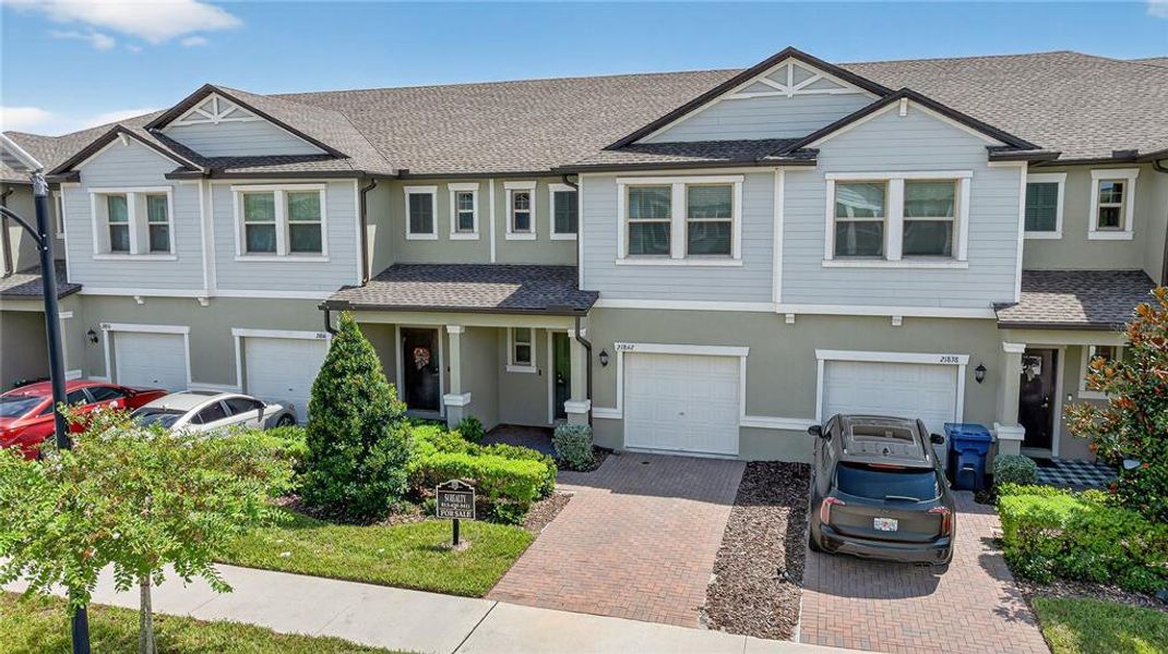 Front exterior of a new home in , Land O' Lakes, FL, highlighting curb appeal (Image 25).