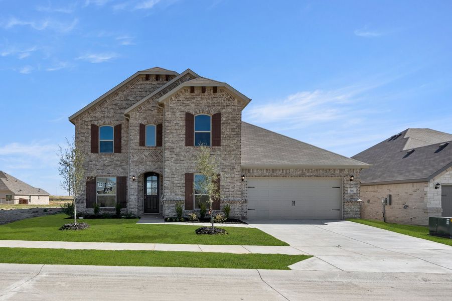 Front exterior of a new home in Still Water Lake Estates, Godley, TX, highlighting curb appeal (Image 1). Front exterior of a new home in Still Water Lake Estates, Godley, TX, highlighting curb appeal (Image 1).
