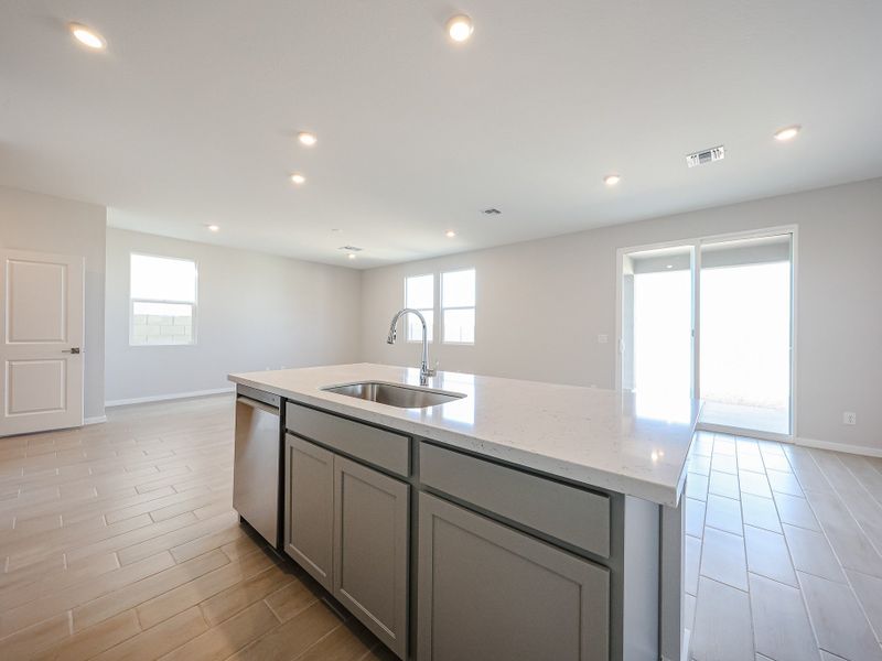 A kitchen with a large island. A kitchen with a large island.