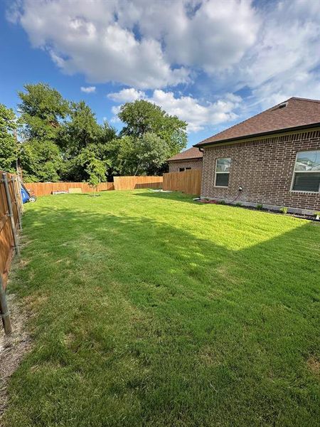 View of fenced backyard