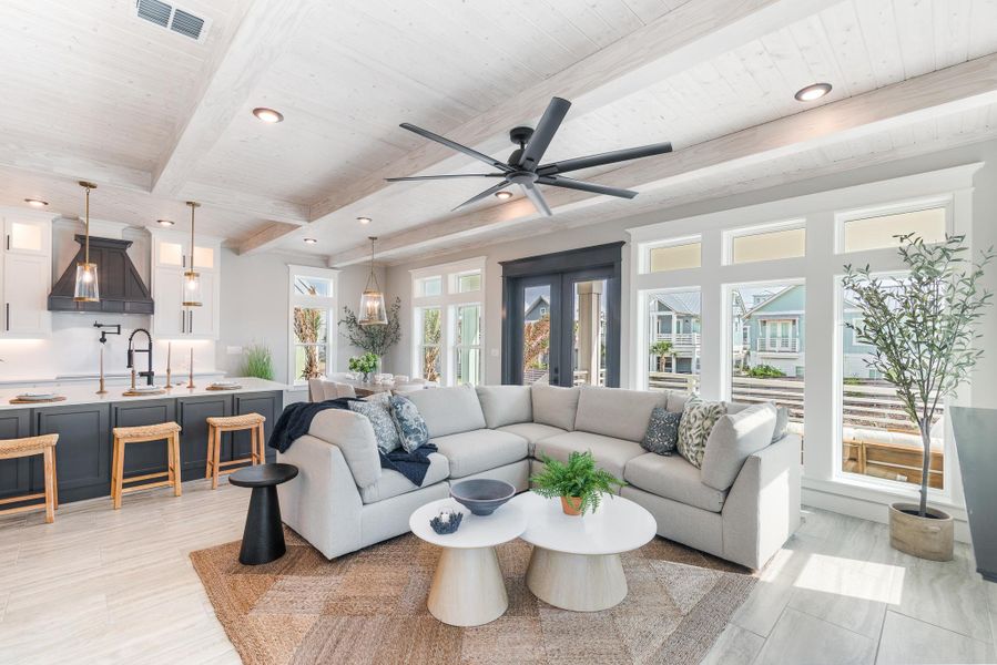 Living room featuring a wood ceiling with exposed beams, recessed lighting, and a ceiling fan Living room featuring a wood ceiling with exposed beams, recessed lighting, and a ceiling fan