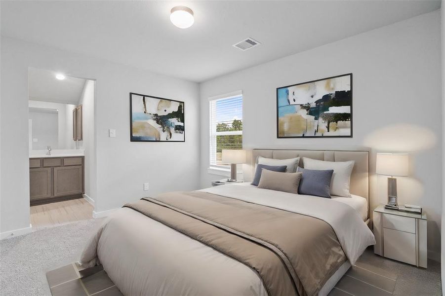 Secondary bedroom features plush carpet, custom paint, high ceilings, and a large window with privacy blinds. This secondary bedroom shares a jack-n-jill bathroom and access to its private vanity sink.