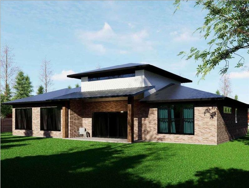 Back of house featuring brick siding, a patio area, a yard, and a standing seam roof Back of house featuring brick siding, a patio area, a yard, and a standing seam roof