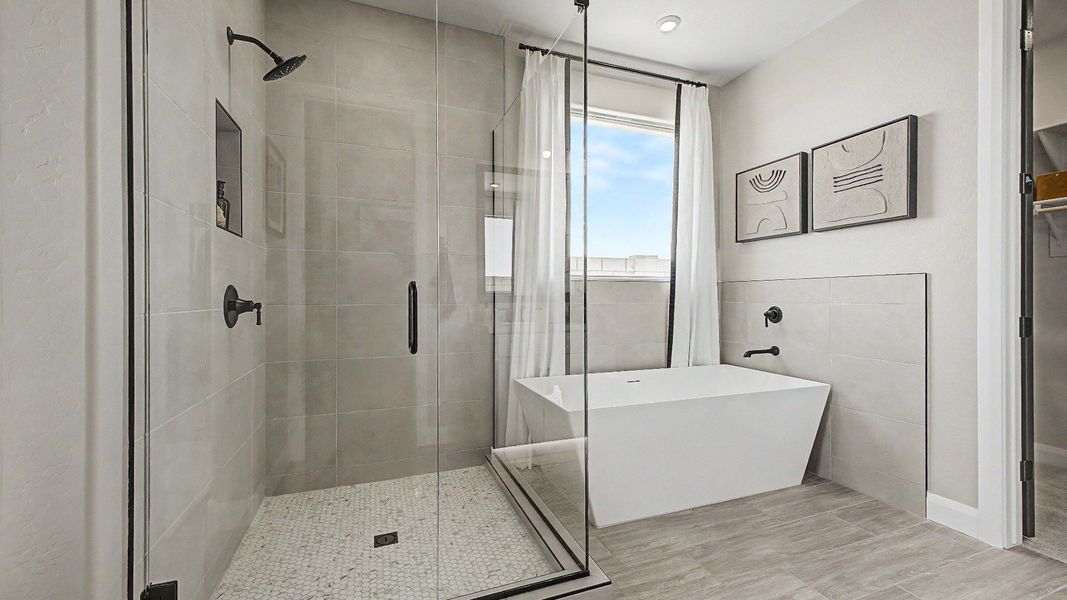 Spa-inspired primary bath with walk-in shower and soaking tub in this quick move-in new home at Saguaro Hills at Vistancia. Spa-inspired primary bath with walk-in shower and soaking tub in this quick move-in new home at Saguaro Hills at Vistancia.