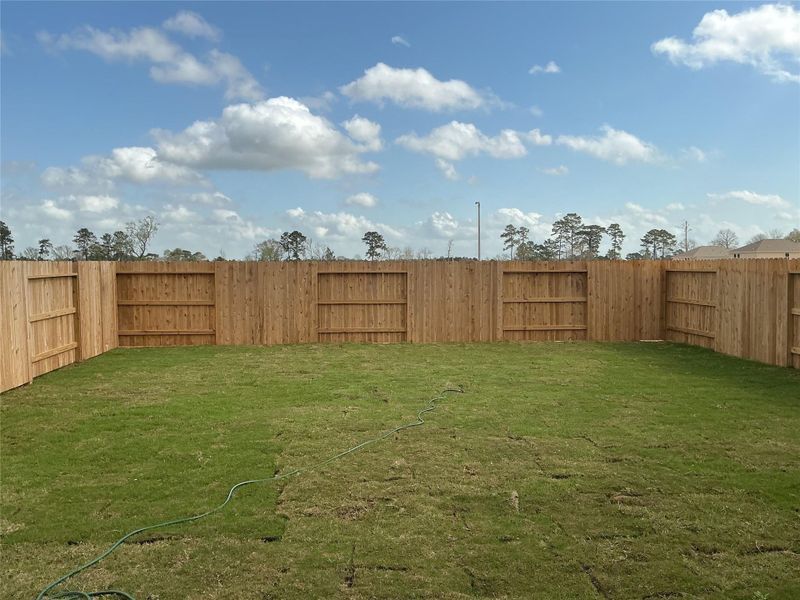 Exterior details and patio area of a home in Stonebrooke, Conroe (Image 3).