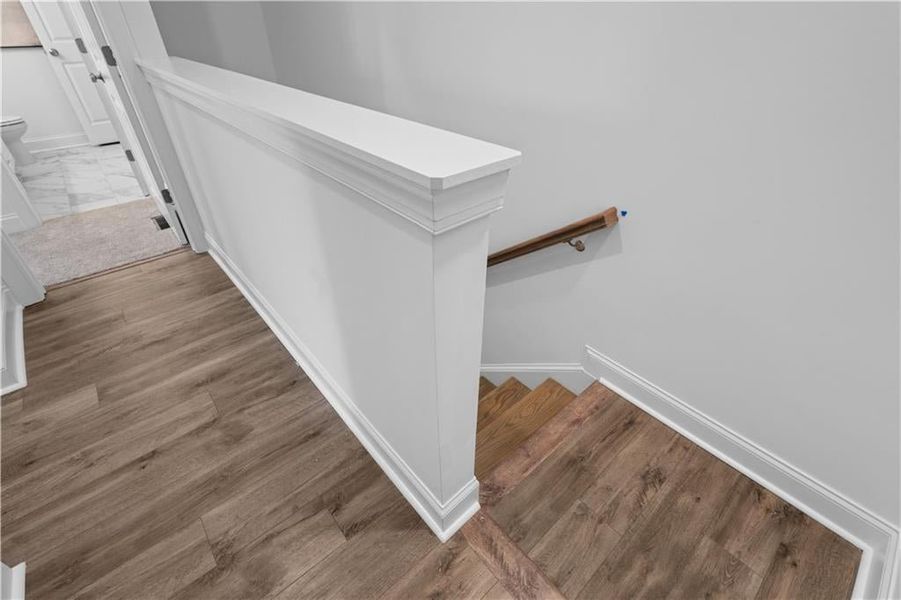 Hardwood Flooring Continues in Hallways and Stairs *Images shown are from a decorated model of the same floor plan. Design selections and color packages will vary by home.* Hardwood Flooring Continues in Hallways and Stairs *Images shown are from a decorated model of the same floor plan. Design selections and color packages will vary by home.*
