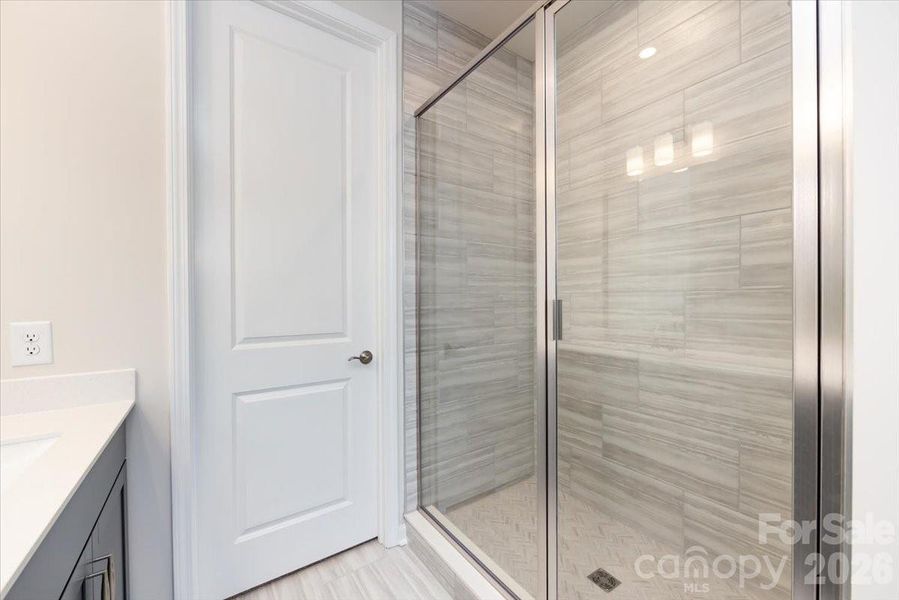 Primary Walk-In Shower with Tiled Shower Walls and Floor Pan Primary Walk-In Shower with Tiled Shower Walls and Floor Pan