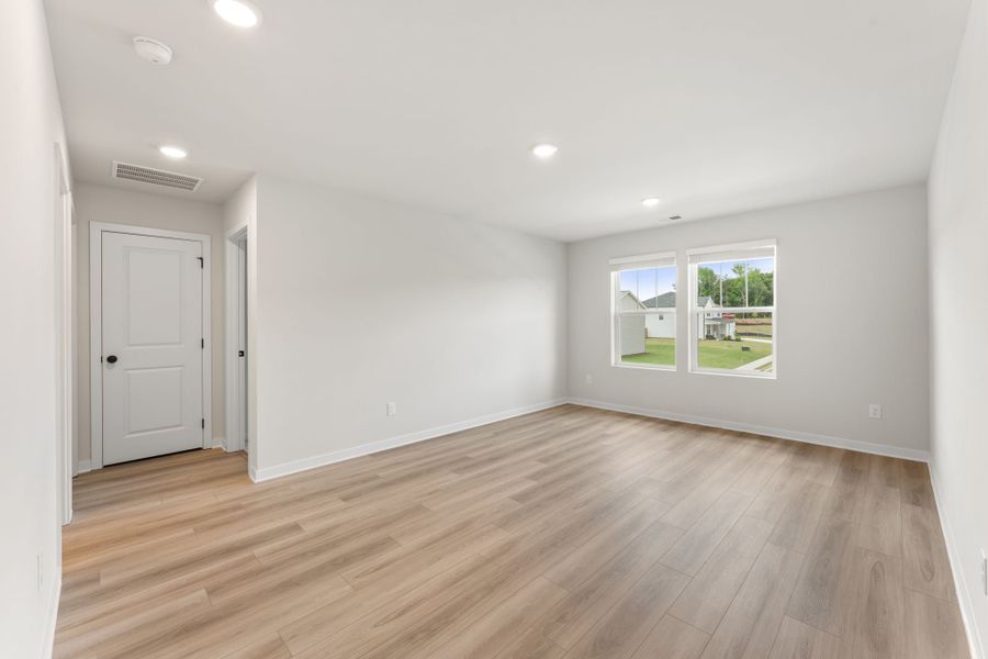 A room with a wood floor and a wood floor.