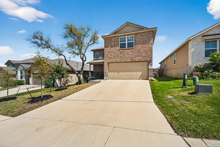Front exterior of a new home in Copper Canyon, Bulverde, TX, highlighting curb appeal (Image 1). Front exterior of a new home in Copper Canyon, Bulverde, TX, highlighting curb appeal (Image 1).
