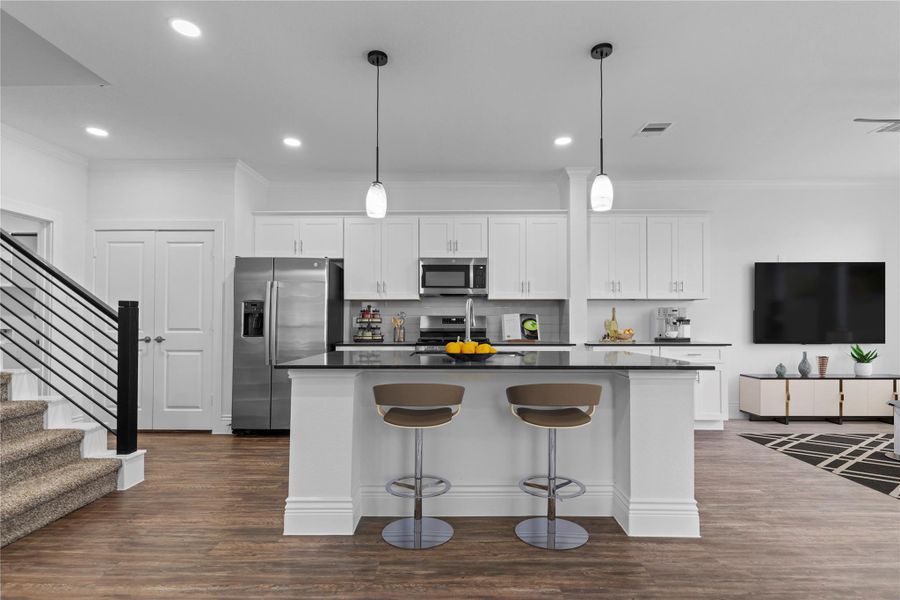 The gourmet kitchen is a cook's dream come true! Large working station island with gorgeous sparkling quartz countertops. Stainless steel side by side refrigerator with ice and water dispenser. Boast beautiful pendant lighting above. French door open to the outstanding pantry for all your storage needs! This home is just calling your name! *Virtually staged* The gourmet kitchen is a cook's dream come true! Large working station island with gorgeous sparkling quartz countertops. Stainless steel side by side refrigerator with ice and water dispenser. Boast beautiful pendant lighting above. French door open to the outstanding pantry for all your storage needs! This home is just calling your name! *Virtually staged*