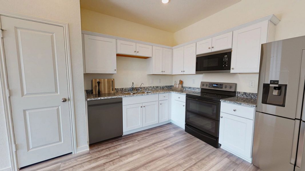 Representative furnished interior of a home built from the Compass by Starlight Homes in Sutton Farms, San Antonio (Image 6).