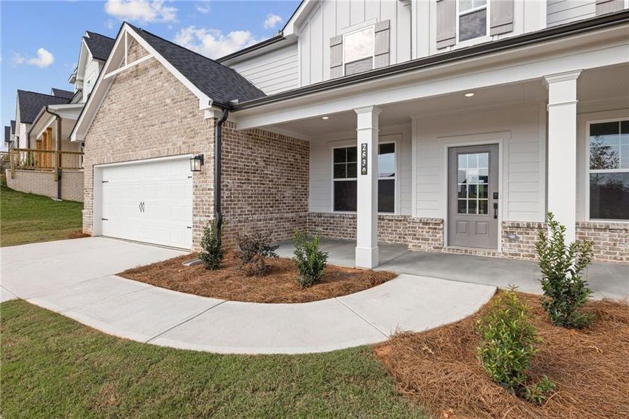 Front exterior of a new home in The Estates at Gainesville Township, Gainesville, GA, highlighting curb appeal (Image 9).