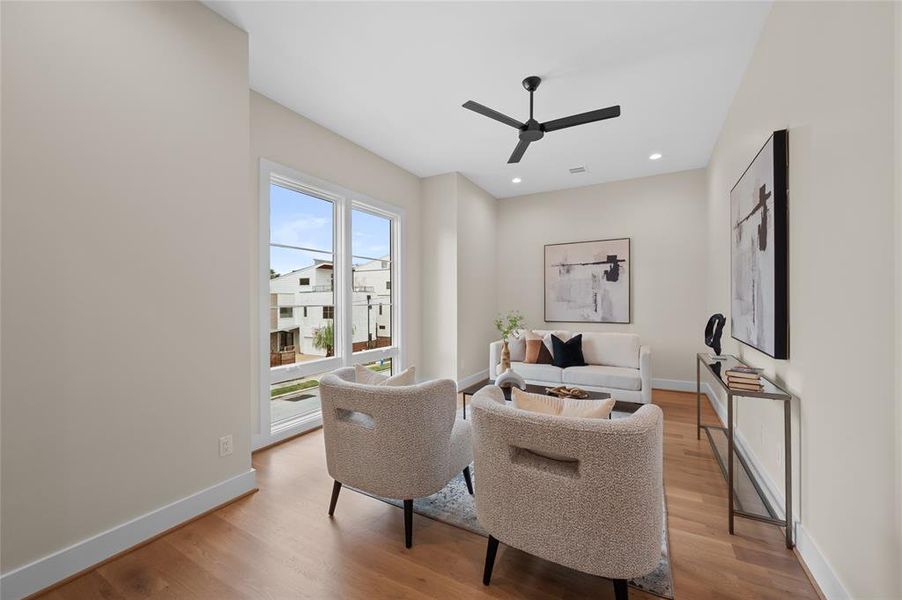 Spacious game room with great natural light and casement windows