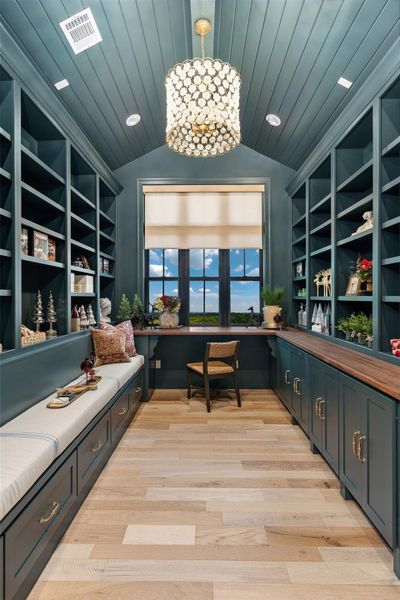 Office featuring built in study area, lofted ceiling, and wood ceiling