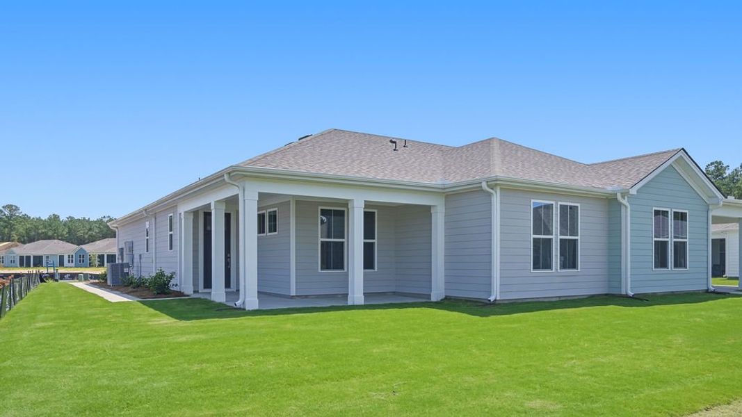 Exterior details and patio area of a home in Sun City Hilton Head, Bluffton (Image 29).