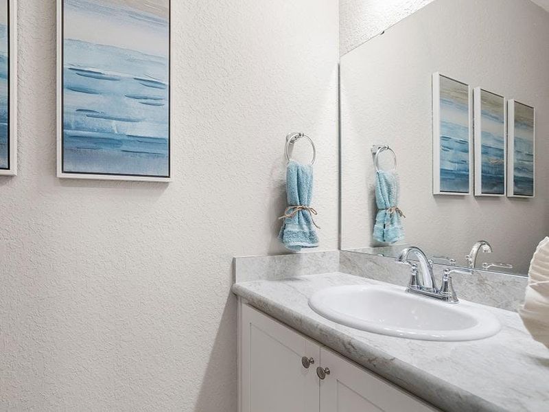 And, a powder room near the gathering room serves your guests - Aubrey by Highland Homes