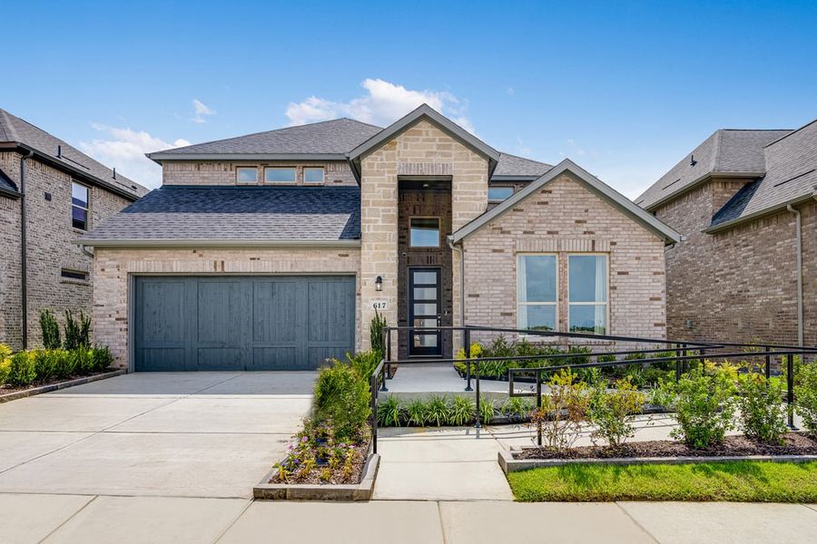 Representative exterior photo of a completed home built from the Carmine by Taylor Morrison in South Oak 50s, Oak Point, TX (Image 22). Representative exterior photo of a completed home built from the Carmine by Taylor Morrison in South Oak 50s, Oak Point, TX (Image 22).