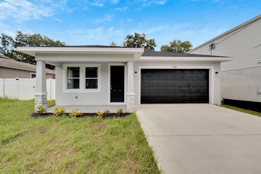 Front exterior of a new home in , Tampa, FL, highlighting curb appeal (Image 28).