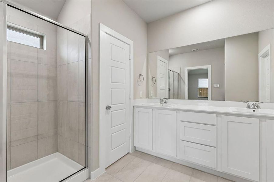 Primary Bathroom in the Emmy II home plan by Trophy Signature Homes - REPRESENTATIVE PHOTO