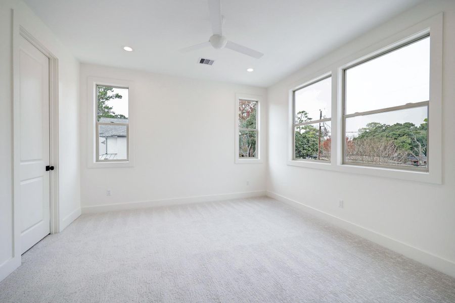 Secondary Bedroom #3 features large windows and a closet with built in shelving. *Previous Project*