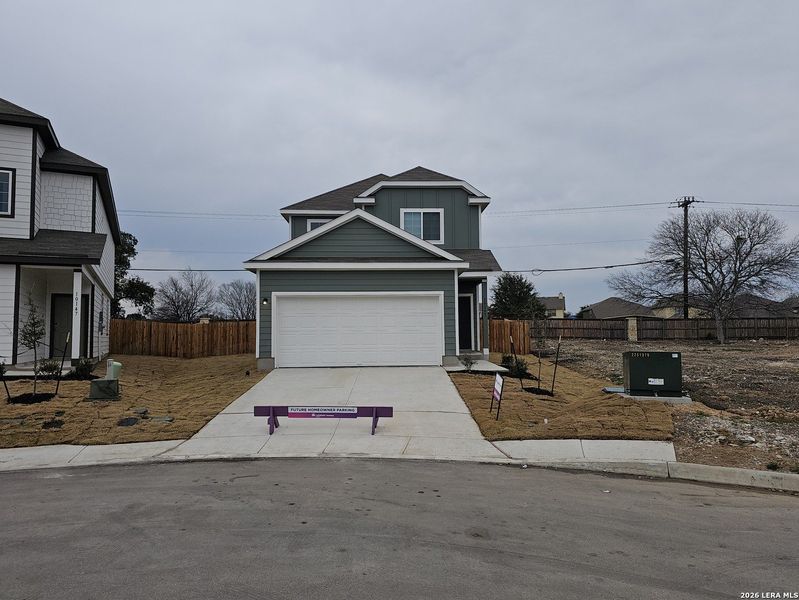 Front exterior of a new home in Melissa Ranch, San Antonio, TX, highlighting curb appeal (Image 24). Front exterior of a new home in Melissa Ranch, San Antonio, TX, highlighting curb appeal (Image 24).