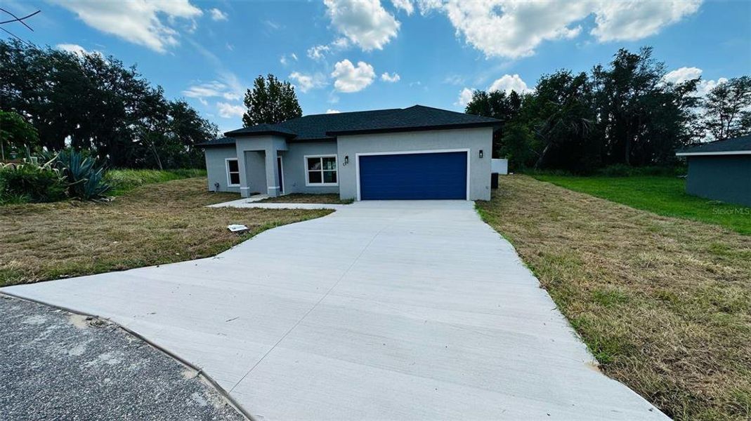 Front exterior of a new home in , Ocala, FL, highlighting curb appeal (Image 7).