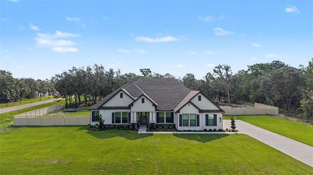 Front exterior of a new home in , Hudson, FL, highlighting curb appeal (Image 2). Front exterior of a new home in , Hudson, FL, highlighting curb appeal (Image 2).