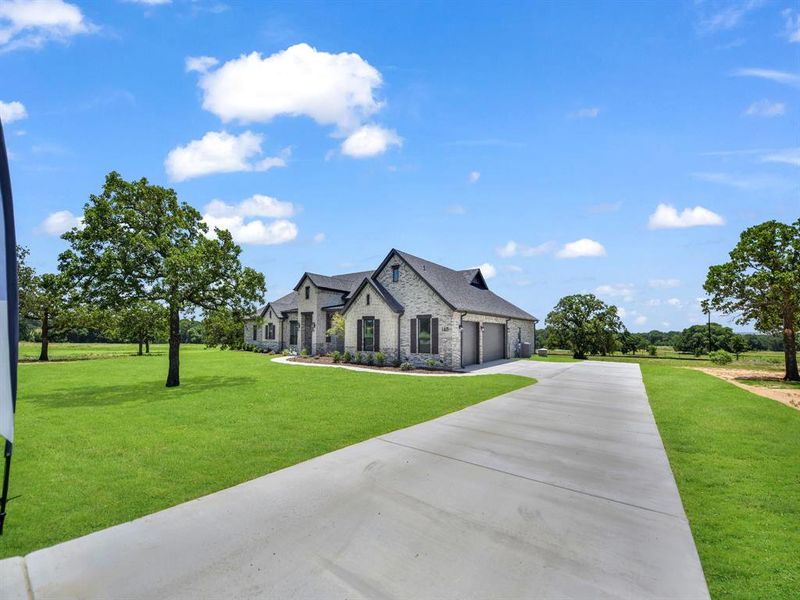 Front exterior of a new home in , Decatur, TX, highlighting curb appeal (Image 26). Front exterior of a new home in , Decatur, TX, highlighting curb appeal (Image 26).