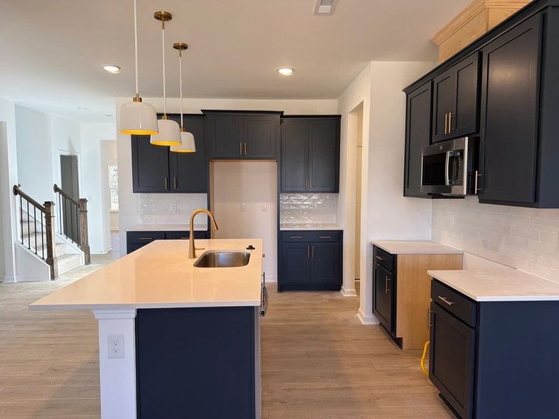 Kitchen featuring the AW Collection® Sapphire - Vibrant blues and crisp whites steal the show.