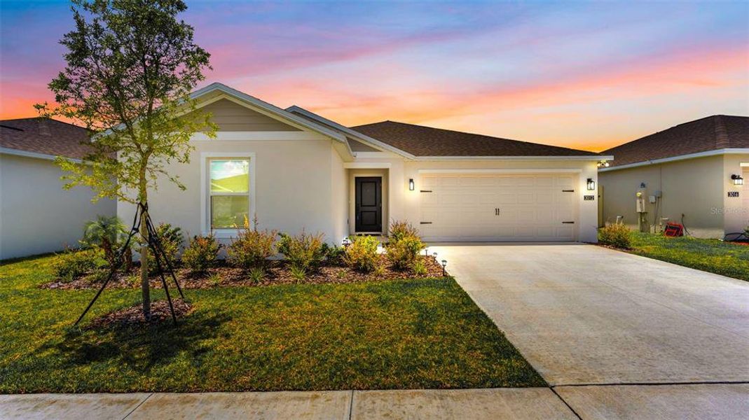 Front exterior of a new home in , Eagle Lake, FL, highlighting curb appeal (Image 2). Front exterior of a new home in , Eagle Lake, FL, highlighting curb appeal (Image 2).