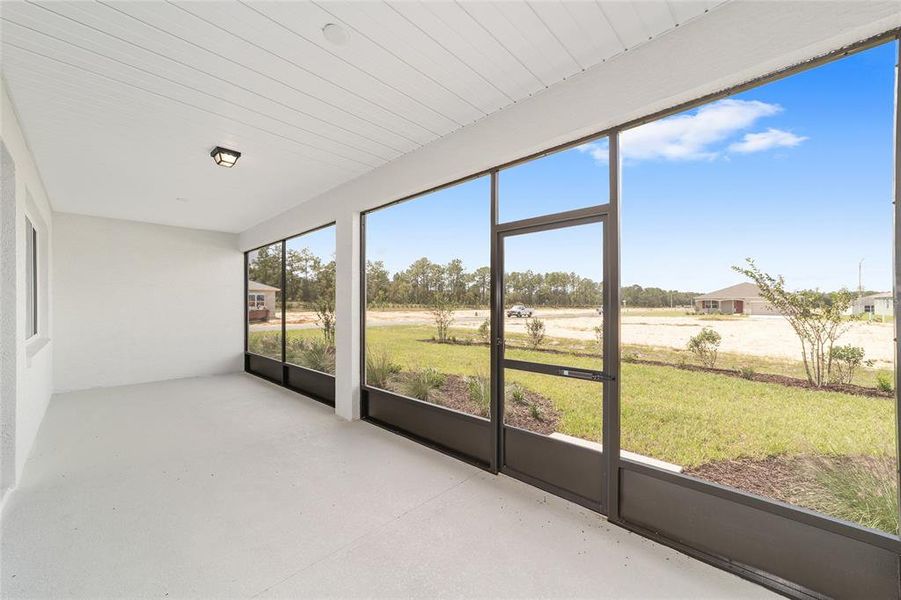 Exterior details and patio area of a home in On Top of the World Communities, Ocala (Image 3).
