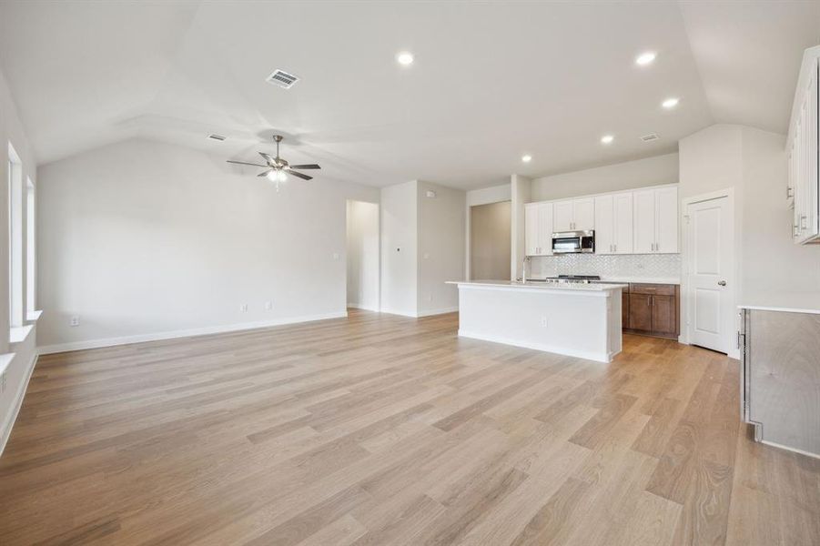 Here you can see how the open floor plan brings the kitchen and living room together.