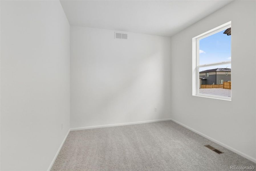 Spacious, unfurnished interior of a new home in The Cottages Collection at Ridgeline Vista, Brighton (Image 15).