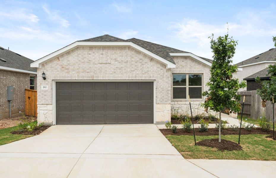Front exterior of a new home in La Cima, San Marcos, TX, highlighting curb appeal (Image 18).