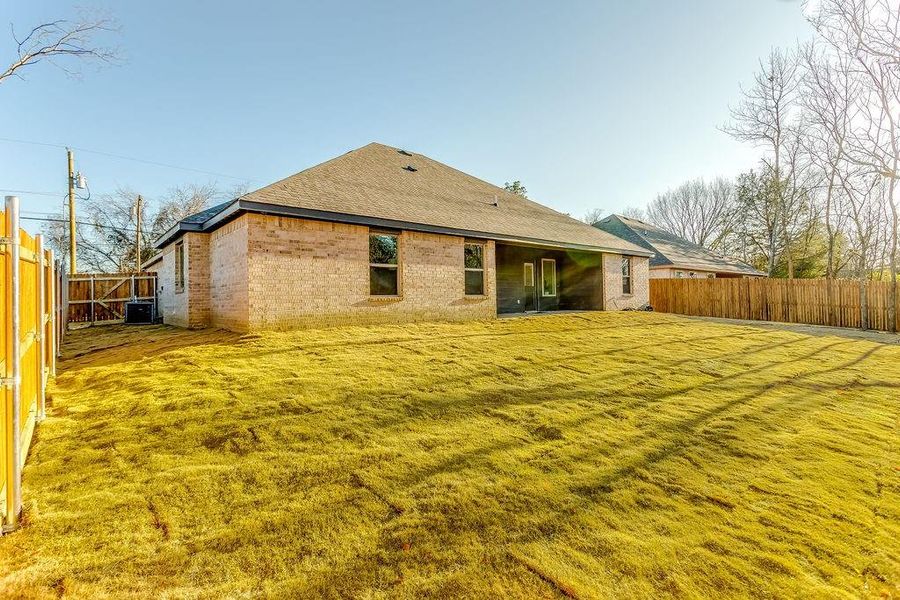 Back of house featuring central AC