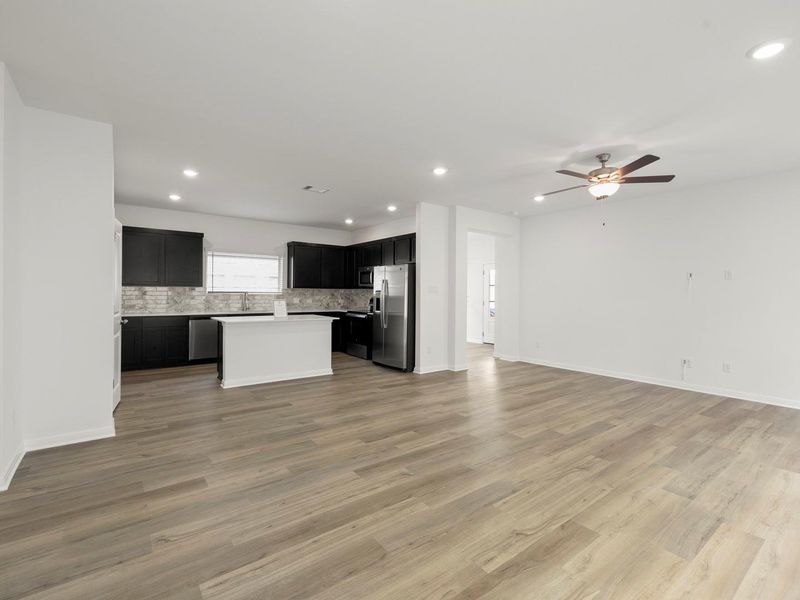An open-concept living space with sleek modern finishes awaits in this pristine home.