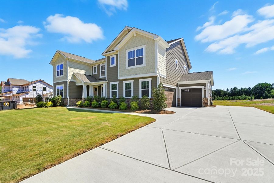 Front exterior of a new home in Blair Place, Monroe, NC, highlighting curb appeal (Image 21).