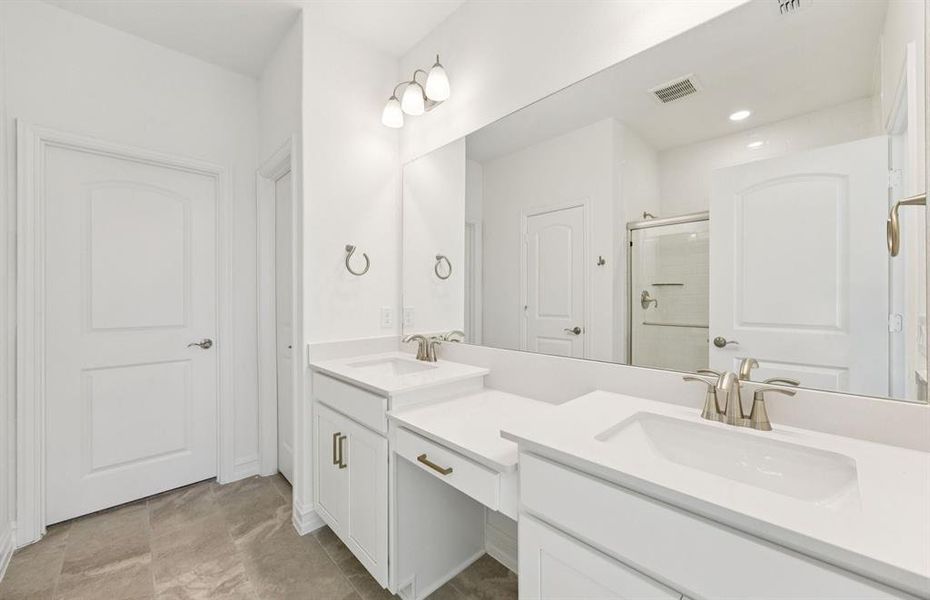 Elegant owner's bathroom with dual vanity *real home pictured Elegant owner's bathroom with dual vanity *real home pictured