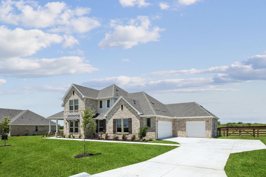 Front exterior of a new home in Ellis Ranch Estates, Waxahachie, TX, highlighting curb appeal (Image 20).